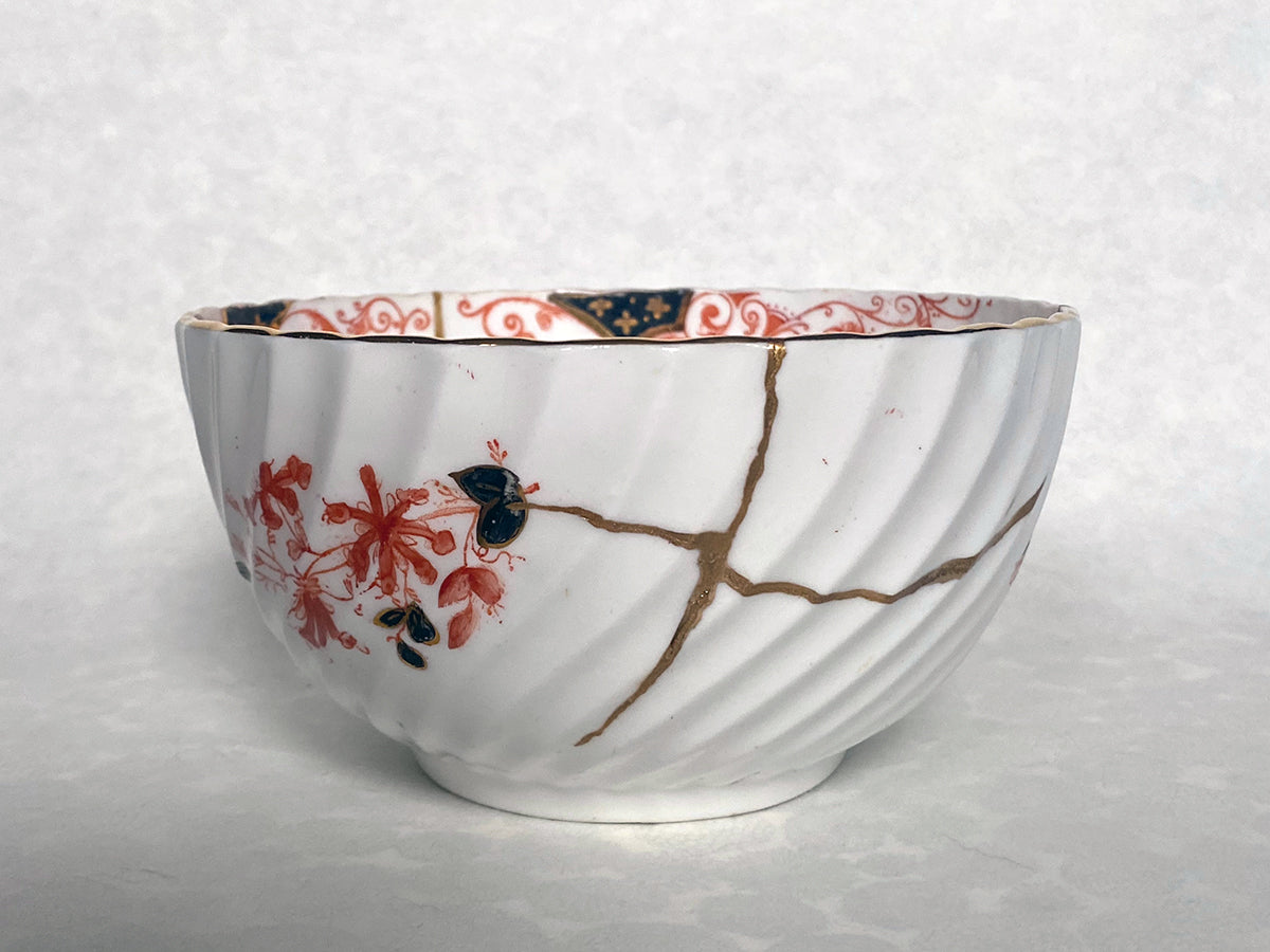 Medium white bowl with red and black floral pattern