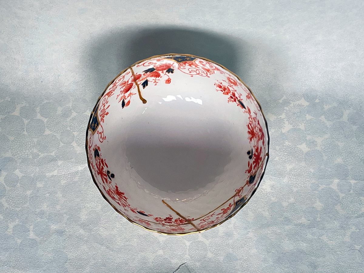 Medium white bowl with red and black floral pattern