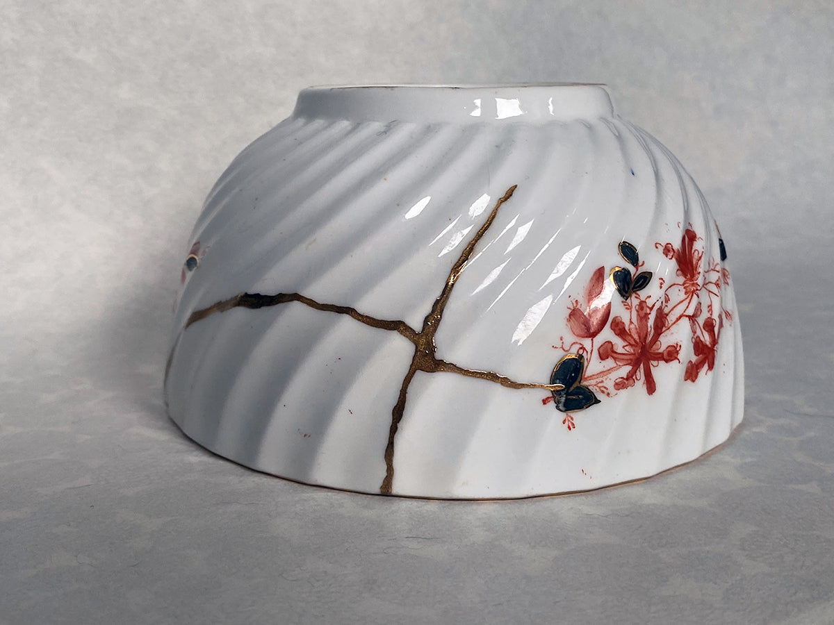 Medium white bowl with red and black floral pattern