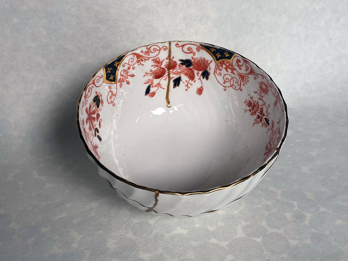 Medium white bowl with red and black floral pattern