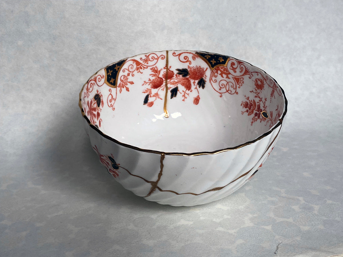 Medium white bowl with red and black floral pattern